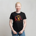 Woman wearing Albinism Awareness short sleeve tee with elephant and ribbon graphic in red and gold on black