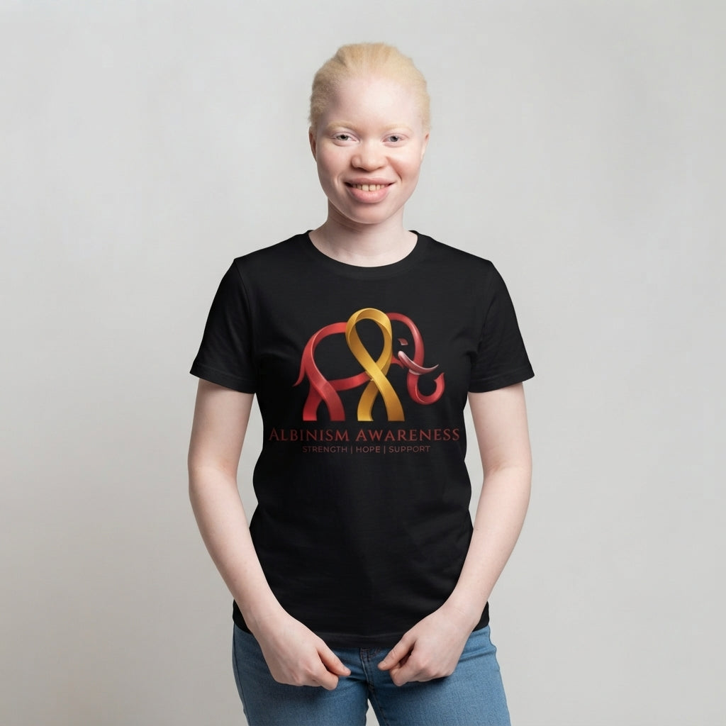 Woman wearing Albinism Awareness short sleeve tee with elephant and ribbon graphic in red and gold on black